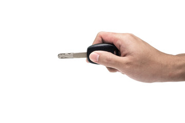 Male hand holding a car key isolated on