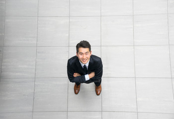 Asian young & success businessman from top view, high angle