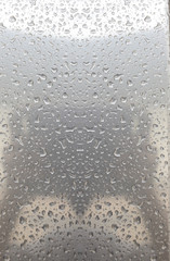 Water drop on metal background.