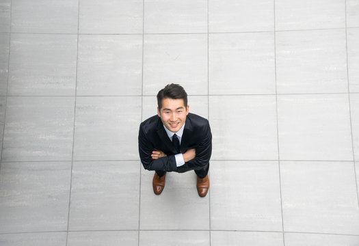 Asian young & success businessman from top view, high angle