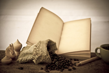 Stock Photo:.Coffee beans with old vintage book