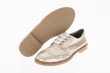  shoe made of pink beige with laces for women on white background