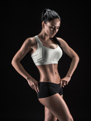 Obraz na płótnie Canvas attractive fitness woman, trained female body, lifestyle portrai