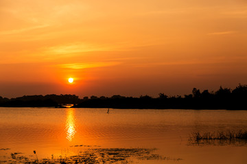 Fototapeta na wymiar Dramatic sky sunset over the lake.