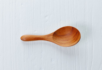 Wooden spoon and wood board background