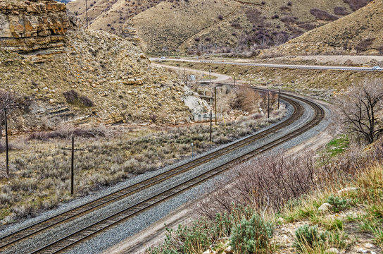 Two Sets of Tracks Curving Through a Canyon 
