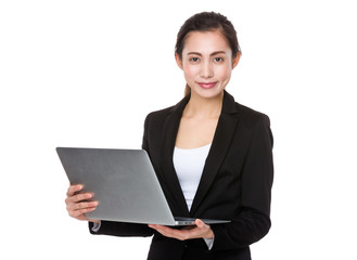 Asian Young businesswoman use of the notebook computer