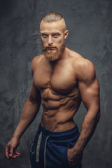 Portrait of awesome muscular guy with beard.