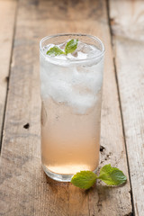 Soft drink strawberry soda and ice cube.