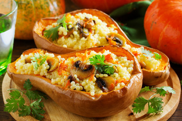 Pumpkin stuffed with couscous with grilled mushrooms.
