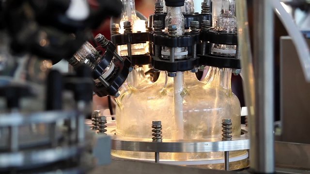 Close up of  process in lab reactor. Lab reactors are used for optimizing and reproducing chemical reaction, mixing, dispersing, and homogenization processes.