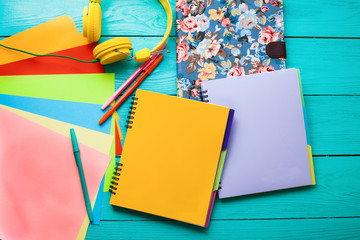 Education accessories with copy space on blue wooden workspace.Top view