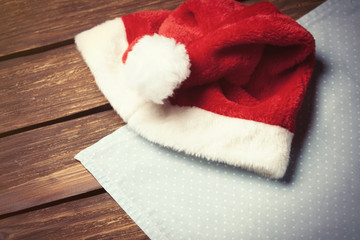 Obraz na płótnie Canvas Red Santas hat and serviette