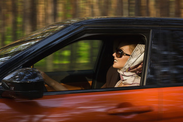 Fashion  woman behind steering wheel