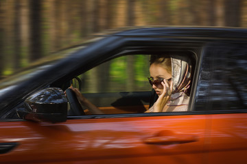 Fashion  woman behind steering wheel