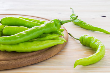 Green peppers placed on the chopping block