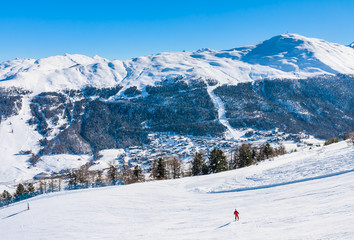 Skier on the slope of  Ski resort Livigno. Italy