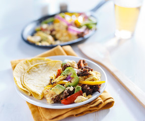 mexican chorizo scrambled eggs with corn tortilla