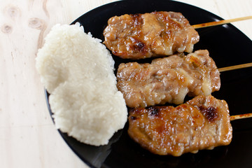 Thai-styled grilled pork and sticky rice. It's among most popular street foods in Thailand.