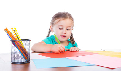 girl draws at the table