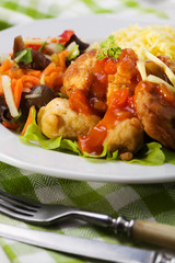 Fried chicken pieces in batter with sweet and sour sauce