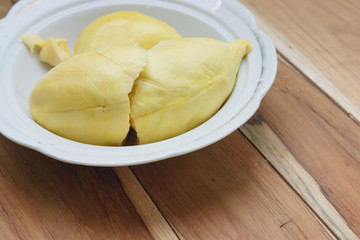 Durian on a wooden background.