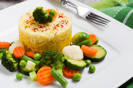 Portion of risotto with vegetables.