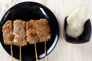 Thai-styled grilled pork and sticky rice. It's among most popular street foods in Thailand.