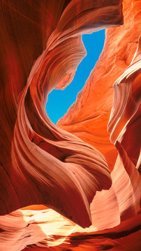 Up to blue sky in slot canyon. The Magic Antelope Canyon in the Navajo Reservation, Arizona