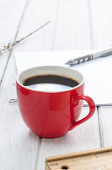 coffee red cup on white wood table