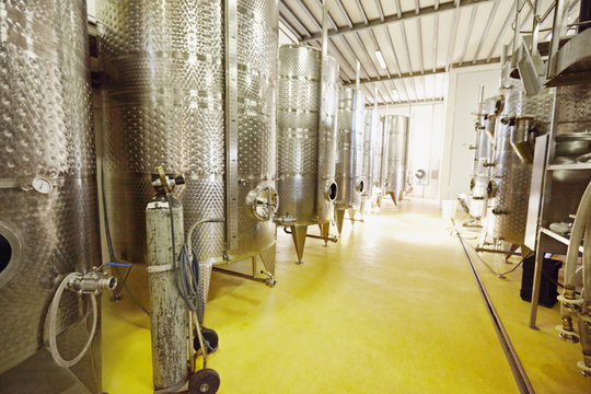 Stainless steel wine fermentation containers in a winery