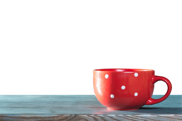 Red cup on a blue table with isolated background