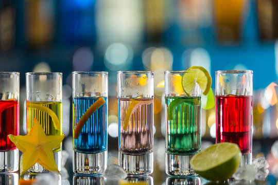 Colored alcoholic shots on bar counter