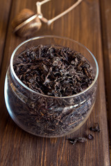 Black dried tea leaves