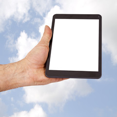 the tablet held in the hand with cloud background