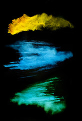 Colored powder on black background