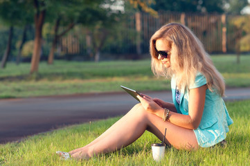 Beautiful girl with tablet in his hands.