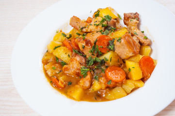 stewed meat with potatoes, onion and carrot