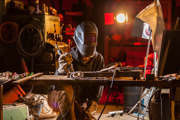 Welder in workshop