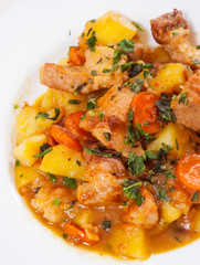 stewed meat with potatoes, onion and carrot