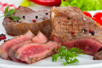 Beef steak on white plate  
