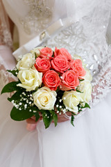 The bride at a wedding holding a bouquet of flowers.