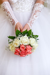 The bride at a wedding holding a bouquet of flowers.