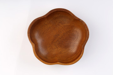 Top view of Flower shape wooden bolw isolated on white backgroun