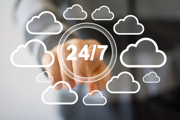 Businessman push button 24 hours service network cloud