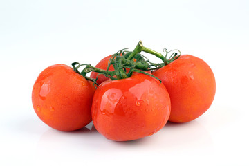 Cool fresh tomatoes isolated on white background