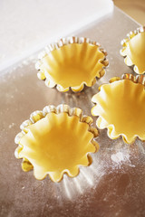 Fresh homemade pasta ready for baking/Raw pasta in cup molds