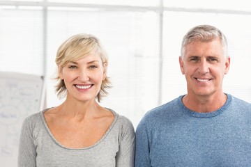 Smiling business colleagues looking at the camera
