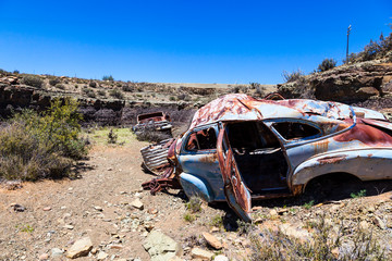 Car wreck - Abandoned cars , from the 1940's or 1950's, were washed down a riverbed during a flood in the Karoo desert, and left to rust where they came to a stop.
