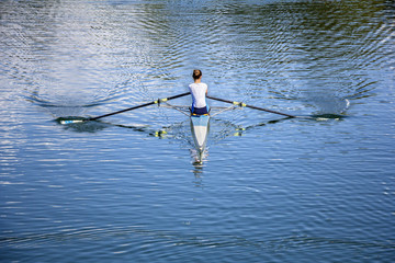 Young Women Rower in a boat - obrazy, fototapety, plakaty